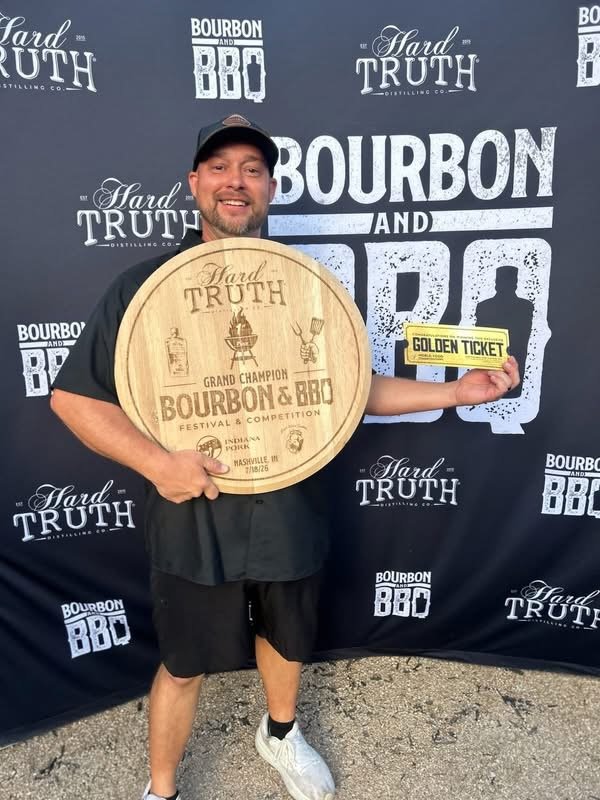 Brandon O’Neal holding the Hard Truth Grand Champion trophy and Golden Ticket